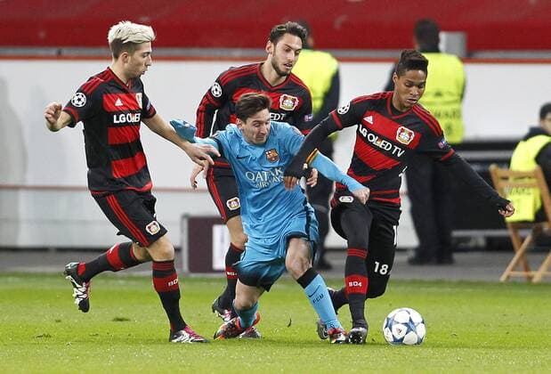 Lionel Messi FC Barcelona Barca (M) challenges Kevin Kampl (Bayer 04 Leverkusen)(L), Hakan Calhanoglu (Bayer 04 Leverkusen) (back) and Wendell (Bayer 04 Leverkusen) during the championsleague match between Bayer 04 Leverkusen and FC Barcelona, Bayarena in Leverkusen on december 9., 2015. Bayer 04 Leverkusen vs. FC Barcelona in der Champions League der Saison 2015 2016 am 9. Dezember 2015.