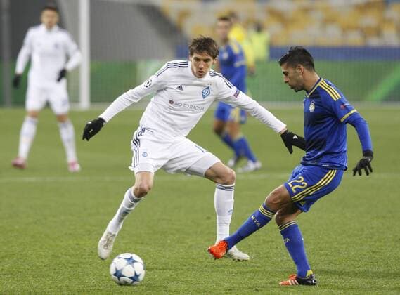 Dec. 9, 2015 - Kiev, Ukraine - DENYS GARMASH (C) of Dynamo in action against AVRAHAM RIKAN (R) of Maccabi during the UEFA Champions League Group G soccer match between Dynamo Kyiv and FC Maccabi Tel-Aviv,at Olimpiyskyi stadium in Kiev, Ukraine, 09 December 2015. Soccer 2015 - DYNAMO vc MACCABI,UEFA Champions League Group G - ZUMAg194