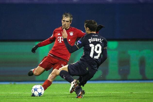 SOCCER - CL, Zagreb vs Bayern ZAGREB,CROATIA,09.DEC.15 - SOCCER - UEFA Champions League, group stage, GNK Dinamo Zagreb vs FC Bayern Muenchen. Image shows Philipp Lahm (Bayern) and Josip Pivaric (Zagreb). GEPAxpictures xMaticxKlansek