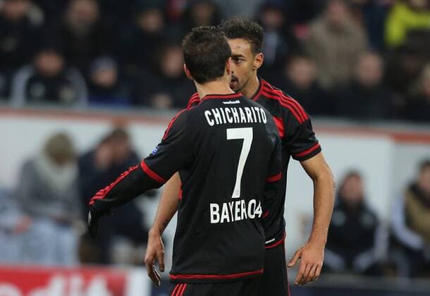 Leverkusen, Germany, 9th Dec 2015. Champions League, Bayer 04 Leverkusen vs FC Barcelona Barca Chicharito ( 7) und Karim Bellarabi (beide Leverkusen) geraten aneinander.