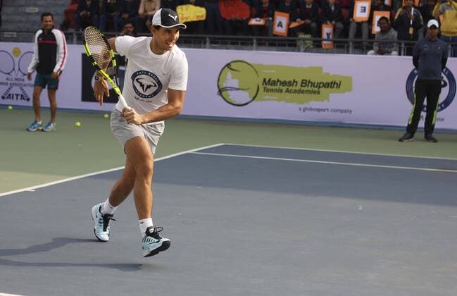 NEW DELHI, INDIA - DECEMBER 10: Rafael Nadal, Spanish Tennis player during the inaugural match for a tie-up between Rafael Nadal Academy and Mahesh Bhupathi Tennis Academies (MBTA) to identify talents in India and offer them the opportunity to receive expert coaching, at R.K. Khanna Tennis Complex , RK Puram, on December 10, 2015 in New Delhi, India. (Photo by Sanchit Khanna Hindustan Times ) Rafael Nadal And Mahesh Bhupathi Tennis Academies Tie Up For Collaboration