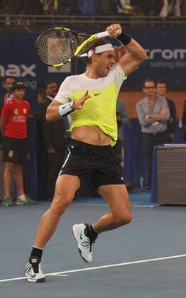 NEW DELHI, INDIA - DECEMBER 12: Rafael Nadal of Micromax Indian Aces Mens in action against Roger Federer of Obi UAE Royals during the Coca-Cola International premier Tennis League at IG Stadium on December 12, 2015 in New Delhi, India. (Photo by Virendra Singh Gosain Hindustan Times ) Coca-Cola International Premier Tennis League