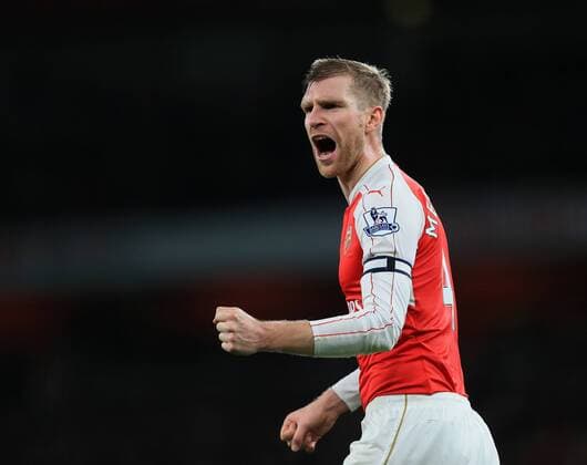 Bilder des Tages Sport Arsenal s Per Mertesacker celebrates his sides second goal Barclays Premier League- Arsenal vs Manchester City - Emirates Stadium - England - 21st December 2015 - Picture David Klein Sportimage EDITORIAL USE ONLY. No use with unauthorised audio, video, data, fixture lists, club league logos or live services. Online in-match use limited to 120 images, no video emulation. No use in betting, games or single club league player publications.