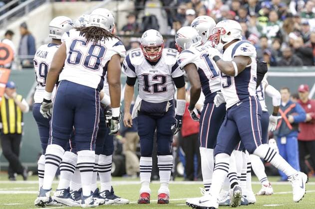 New England Patriots quarterback Tom Brady stands in the huddle in the 2nd quarter against the New York Jets quarter at MetLife Stadium in East Rutherford, New Jersey on December 27, 2015.  NYP20151227101 JOHNxANGELILLO