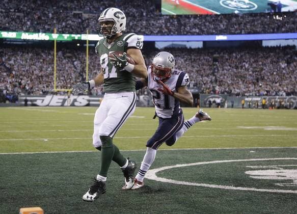 New England Patriots Malcolm Butler defends New York Jets Eric Decker who catches a 6 yard game-winning touchdown pass in overtime at MetLife Stadium in East Rutherford, New Jersey on December 27, 2015. The Jets defeated the Patriots 26-20 in overtime.  NYP20151227105 JOHNxANGELILLO