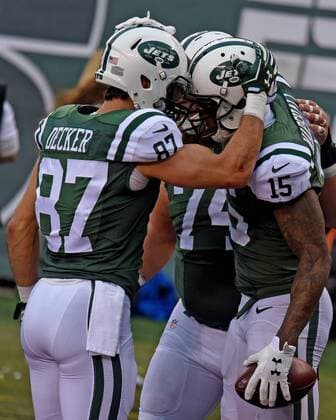 Dec. 27, 2015 - East Rutherford, New Jersey, U.S - New York Jets wide receivers BRANDON MARSHALL and ERIC DECKER celebrate BRANDON MARSHALL S touchdown reception against the New England Patriots in the first quarter at MetLIFE stadiium giving the Jets a 10-3 lead. The Jets went on to win 26-20 in overtime. NFL2015 - Jets defeat patriots 26-20 - ZUMAd50_