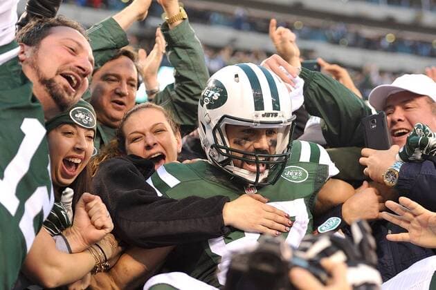 December 27, 2015 - East Rutherford, New Jersey, U.S. - New York Jets wide receiver ERIC DECKER (87) celebrates his game winning touchdown with Jets fans at MetLife Stadium in East Rutherford New Jersey New York defeats New England 26 to 20 (Credit: NFL American Football Herren USA 2015: Hometown Jets Squeak by Patriots 26-20 in OT  - ZUMA
