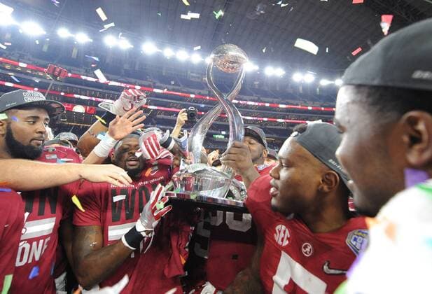 The Alabama Crimson Tide celebrate their 38-0 win over the Michigan State Spartans in the College Football Playoff Semifinal at the Goodyear Cotton Bowl Classic at AT&T Stadium on December 31, 2015 in Arlington, Texas. The Tide will face Clemson in the National Championship on January 11, 2016.  DAL20151231113 IanxHalperin