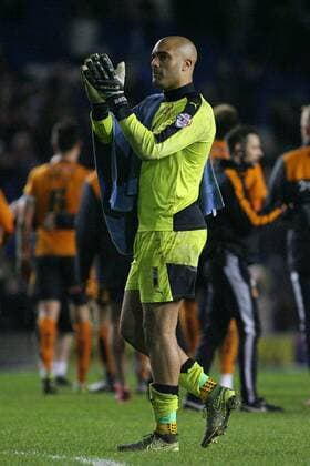 Football - 2015 2016 The Championship - Brighton and Hove Albion vs.Wolverhampton Wanderers Carl Ikeme of Wolverhampton Wanderers applauds the traveling Wolves fans at the final whistle after his heroics earned Wolves the three points at the Amex Stadium Brighton Colorsport Shaun Boggust 