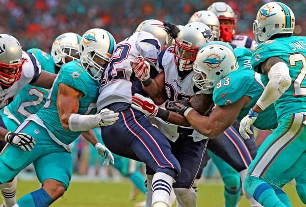 Jan. 3, 2016 - Miami Gardens, FL, USA - The Miami Dolphins defensive line sacks New England Patriots quarterback Tom Brady during the fourth quarter on Sunday, Jan. 3, 2016, at Sun Life Stadium in Miami Gardens, Fla. New England Patriots at Miami Dolphins - ZUMAm67_