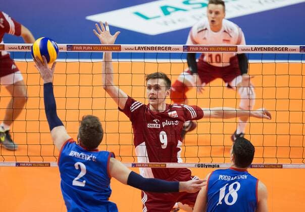Berlin, Deutschland, 05.01.2016: Volleyball Olympia Qualifikation Männer Maenner 2016 - Spiel 3 Serbien - Polen. Uros Kovacevic (Serbia 2) against Mateusz Bieniek (Poland 9)