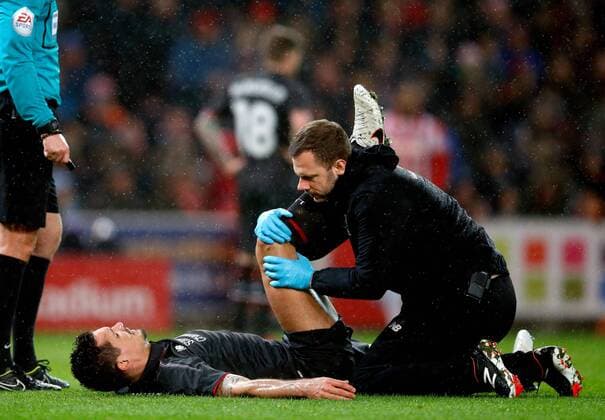 Dejan Lovren of Liverpool receives treatment on him hamstring before going off injured - Capital One Cup - Semi final first leg - Stoke City vs Liverpool - Britannia Stadium - Stoke on Trent - England - 5th January 2015 - Picture Simon Bellis SportImage EDITORIAL USE ONLY. No use with unauthorised audio, video, data, fixture lists, club league logos or live services. Online in-match use limited to 120 images, no video emulation. No use in betting, games or single club league player publications.