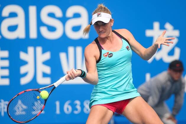 SHENZHEN, CHINA - JANUARY 07: (CHINA OUT) Timea Babos of Hungary returns a shot against Eugenie Bouchard of Canada in quarter finals match during Day five of 2016 WTA Tennis Damen Shenzhen Open at Longgang Sports Center on January 7, 2016 in Shenzhen, Guangdong Province of China.  CFP477886441 