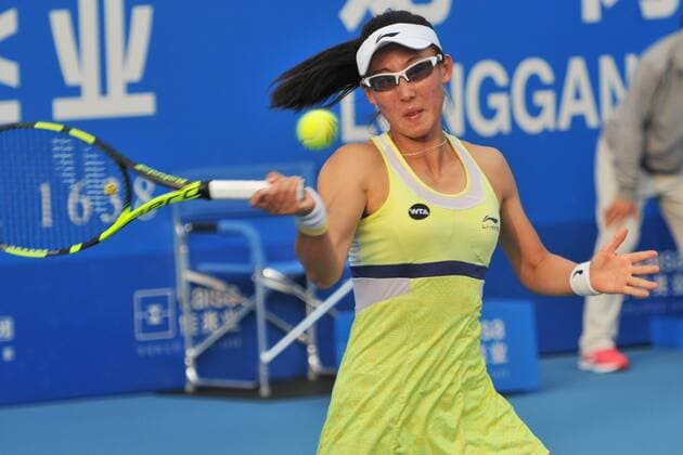SHENZHEN, CHINA - JANUARY 08: (CHINA OUT) Zheng Saisai of China returns a shot with Xu Yifan of China against Cagla Buyukakcay of Turkey and Alexandra Krunic of Serbia in Women s doubles semi-final match during Day six of 2016 WTA Tennis Damen Shenzhen Open at Longgang Sports Center on January 8, 2016 in Shenzhen, Guangdong Province of China.  CFP477926677 