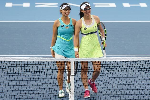 SHENZHEN, CHINA - JANUARY 08: (CHINA OUT) Xu Yifan (L) and Zheng Saisai of China smile after winning against Cagla Buyukakcay of Turkey and Alexandra Krunic of Serbia in Women s doubles semi-final match during Day six of 2016 WTA Tennis Damen Shenzhen Open at Longgang Sports Center on January 8, 2016 in Shenzhen, Guangdong Province of China.  CFP477926682 