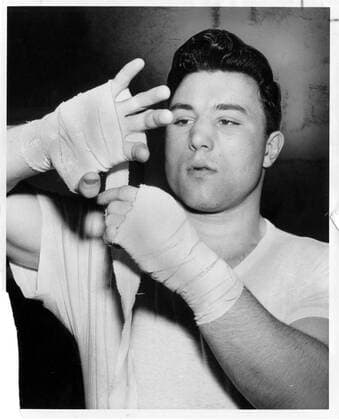 MAR 21, 1961 -- George Chuvalo tapes his hand before a workout  - ZUMAt14_