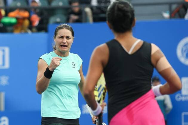 SHENZHEN, CHINA - JANUARY 09: (CHINA OUT) Monica Niculescu of Romania celebrates during her double match with Vania King of USA against Xu Yifan of China and Zheng Saisai of China in Women s doubles final match on day seven of 2016 WTA Tennis Damen Shenzhen Open at Longgang Sports Center on January 9, 2016 in Shenzhen, Guangdong Province of China.  CFP477956317 