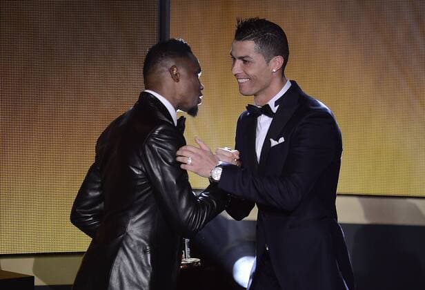 Jan. 11, 2016 - Zurich, Switzerland - The finalist for the FIFA Ballon DOR 2015 CRISTIANO RONALDO (Portugal) receiving his trophy of FIFA FIFPro World Xl, the best 11 players of the year 2015 by the hands of SAMUEL ETO O (L) during the press conference PK Pressekonferenz at Kongresshaus in Zurich. Soccer 2016 - FIFA Ballon D OR 2015  - ZUMAm119