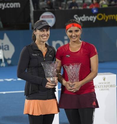 (160116) -- SYDNEY, Jan. 15, 2016 -- Martina Hingis (L) of Switzerland and Sania Mirza of India pose for photograph during the awarding ceremony of the women s doubles final against Caroline Garcia and Kristina Mladenovic of France at the Apia International Sydney tennis tournament in Sydney, Australia, Jan. 15, 2016. Martina Hingis and Sania Mirza won 2-1. ) (SP)AUSTRALIA-SYDNEY-TENNIS-APIA INTERNATIONAL SYDNEY ZhuxHongye 