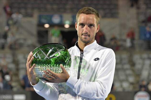 16.01.16 Sydney, Australia. Viktor Troicki (SRB) with trophy as he wins the mens singles title defeating Grigor Dimitrov (BUL) in the mens singles final match at the Apia International Sydney. He receives the trophy from Ken Roewall. Troicki won the final 2-6,6-1,7-6. xNigelxOwenx  ActionPlus11697419