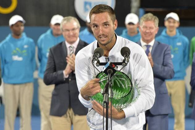 16.01.16 Sydney, Australia. Viktor Troicki (SRB) with trophy as he wins the mens singles title defeating Grigor Dimitrov (BUL) in the mens singles final match at the Apia International Sydney. He receives the trophy from Ken Roewall. Troicki won the final 2-6,6-1,7-6. xNigelxOwenx  ActionPlus11697413