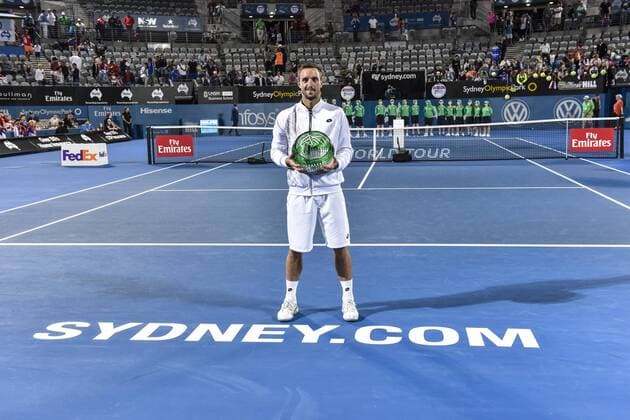 Bilder des Tages - Sport 16.01.16 Sydney, Australia. Viktor Troicki (SRB) with trophy as he wins the mens singles title defeating Grigor Dimitrov (BUL) in the mens singles final match at the Apia International Sydney. He receives the trophy from Ken Roewall. Troicki won the final 2-6,6-1,7-6. xNigelxOwenx  ActionPlus11697429