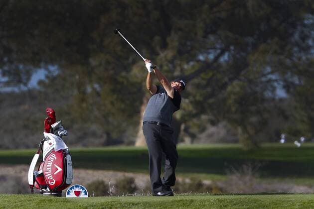 Jan. 27, 2016 - San Diego, CA, USA - SAN DIEGO, CA, USA -- JANUARY 27, 2016: ..At the Farmers Pro-Am played at Torrey Pine Wednesday in San Diego, Phil Mickelson tees off onto the 9th green on the north course. At the Farmers Pro-Am played at Torrey Pine Wednesday in San Diego, Phil Mickelson tees off onto the 9th green on the north course. - ZUMAs44_