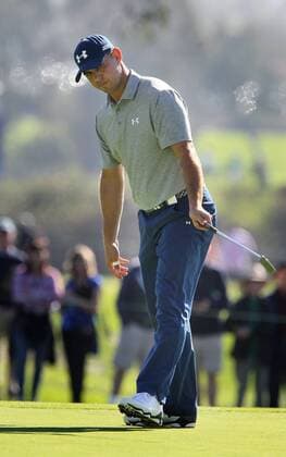 Jan. 29, 2016 - San Diego, CA, USA - Gary Woodland makes a long putt to save par on the 15th hole during the second round of the Farmers Insurance Open on Torrey Pines south course on Friday, Jan. 29, 2016. Rickie Fowler looks to the ocean as he waits to putt on scenic hole 3 of the South Course. - ZUMAm67_