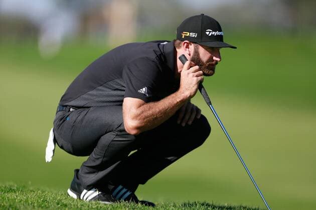 Jan. 29, 2016 - San Diego, CA, USA - Dustin Johnson lines up a putt during the second round of the Farmers Insurance Open on Torrey Pines north course on Friday, Jan. 29, 2016. Rickie Fowler looks to the ocean as he waits to putt on scenic hole 3 of the South Course. - ZUMAm67_