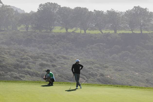 Jan. 29, 2016 - San Diego, California, United States - January 29, 2016, San Diego, California, USA_ Farmers Insurance Open Day 2- Rickie Fowler looks to the ocean as he waits to putt on scenic hole 3 of the South Course. _Mandatory Photo Credit: Photo by Golf 2016 - Farmers Insurance Open - Day 2 - ZUMAs44_