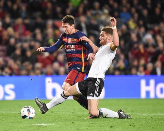Valencia s Shkodran Mustafi and FC Barcelona Barca s Lionel Messi during Spanish King Cup match. February 3, 2016.  (2016020356)