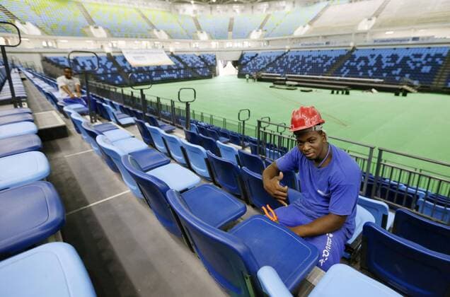 Construction under way with clock ticking until Rio Olympics A construction worker adjusts seats at the Carioca Arena, the venue of Rio de Janeiro Olympics basketball events, at the Barra Olympic Park in the Brazilian city on Feb. 3, 2016. Although 97 percent of the venues at the Olympic park are ready, work is still ongoing in the summer heat with just over a half a year to go to the start of the Games. 