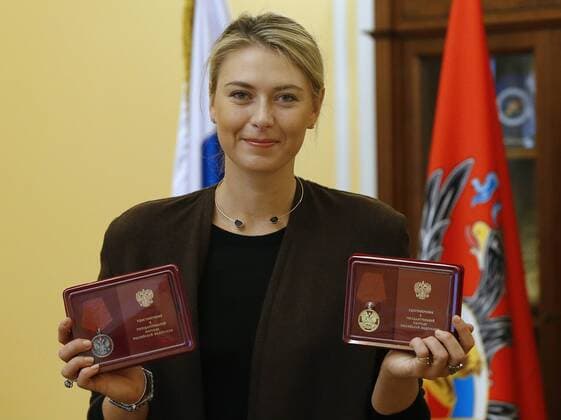 MOSCOW, RUSSIA. FEBRUARY 5, 2016. Russian professional tennis player Maria Sharapova holds a Medal of the Order For Merit to the Fatherland (2nd class) that she has received for her charity work and a Medal of the Order For Merit to the Fatherland (1st class) that she has received for her great contribution into the physical culture and sports development, during a ceremony to present state awards. Andrei Golovanov TASS  TS0169A9
