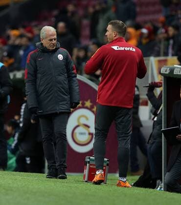 Turkey superlig soccer match between Galatasaray and Torku Konyaspor at Turk Telekom Arena in Istanbul on February 06, 2016. Pictured: Coach Mustafa Denizli and Lukas Podolski of Galatasaray . 