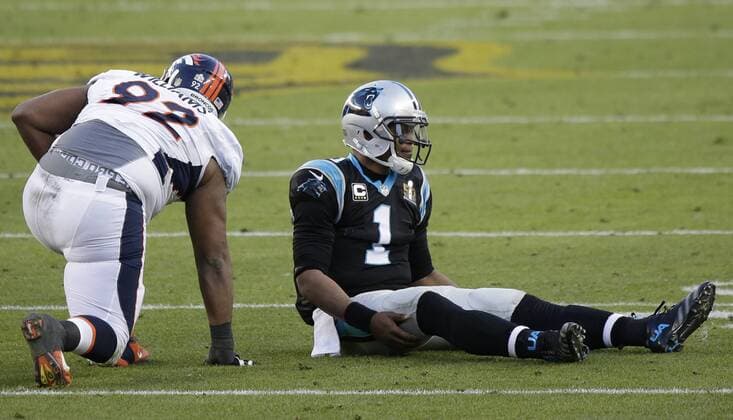 Carolina Panthers quarterback Cam Newton (1) sits on the ground next to Denver Broncos nose tackle Sylvester Williams after an incomplete pass in the second quarter during Super Bowl 50 at Levi s Stadium in Santa Clara, California on February 7, 2016.  SBP20160207442 JOHNxANGELILLO