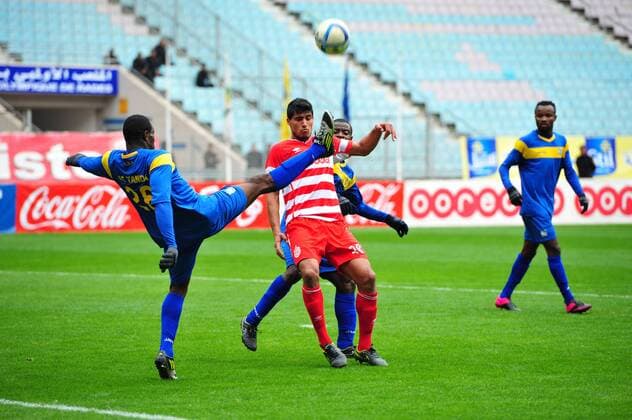 Saif Tka (R) the African club and and Aka N guessan Saraphin(L) AS Tanda during the first round match of the league of the African champions clubs between Club African and Ivorian club team AS Tanda to the stadium of Rades. The Champions League: Club Africain vs AS Tanda (2-0). 