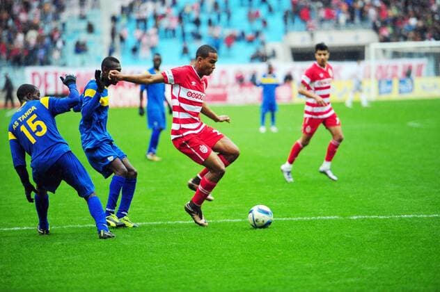 Saif Jaziri (R)of African Club and N goran Martial(15) AS Tanda during the first round match of the league of the African champions clubs between Club African and Ivorian club team AS Tanda to the stadium of Rades. The Champions League: Club Africain vs AS Tanda (2-0). 