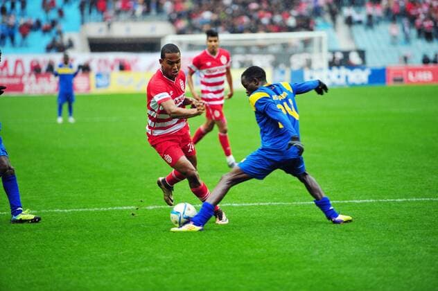 Saif Jaziri (L)of African Club and Siahoun Abdoul Aziz(21) AS Tanda during the first round match of the league of the African champions clubs between Club African and Ivorian club team AS Tanda to the stadium of Rades. The Champions League: Club Africain vs AS Tanda (2-0). 