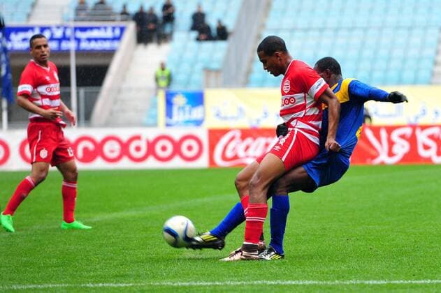 Saif Jaziri (L)of African Club and Aka N guessan Seraphin AS Tanda during the first round match of the league of the African champions clubs between Club African and Ivorian club team AS Tanda to the stadium of Rades. The Champions League: Club Africain vs AS Tanda (2-0). 