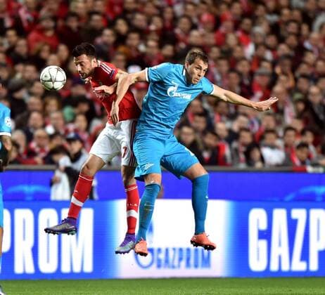 Benfica s Andreas Samaris (L) vies for the ball during the first leg of round 16 of the Eurpean Champions League soccer match SL Benfica vs FC Zenit at the Luz stadium in Lisbon on Feb. 16, 2016. Benfica won 1-0. ) (SP)PORTUGAL-LISBON-SOCCER-UEFA CHAMPIONS LEAGUE-BENFICA VS ZENIT ZhangxLiyun 