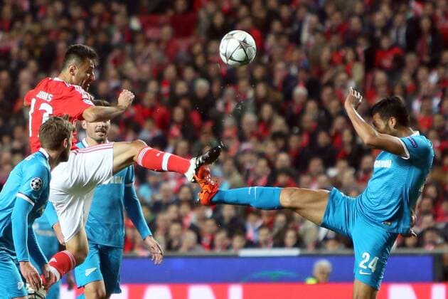 Feb. 16, 2016 - Lisbon, Portugal - Benfica s forward Jonas vies with Zenit s defender Ezequiel Garay during the UEFA Champions League round of 16 football match between SL Benfica and FC Zenith at the Luz stadium in Lisbon on February 16, 2016. UEFA Champions League - Benfica Vs Zenith  - ZUMAn230