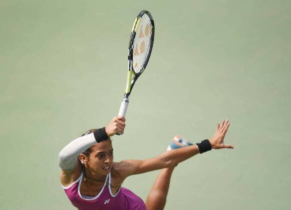 NEW DELHI, INDIA - FEBRUARY 17: Indian tennis player Ankita Raina in action against Russian tennis player Marina Melnikova during Delhi Open 2016 tournament at DLTA Complex (Delhi Lawn Tennis Association) on February 17, 2016 in New Delhi, India. (Photo by Vipin Kumar Hindustan Times ) Delhi Open 2016 Tournament