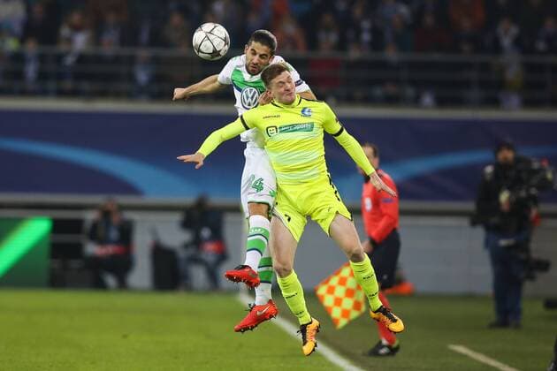 Wolfsburg s Ricardo Rodriguez and Gent s Thomas Foket fight for the ball during a game between Belgian KAA Gent and German VfL Wolfsburg, a first leg of the 1 8 finals of the UEFA Champions League competition, in Gent, Wednesday 17 February 2016. BRUNOxFAHY  x04794732x