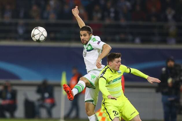 Wolfsburg s Ricardo Rodriguez and Gent s Thomas Foket fight for the ball during a game between Belgian KAA Gent and German VfL Wolfsburg, a first leg of the 1 8 finals of the UEFA Champions League competition, in Gent, Wednesday 17 February 2016. BRUNOxFAHY  x04794734x
