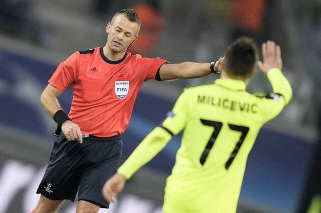 Norwegian referee Svein Oddvar Moen and Gent s Danijel Milicevic pictured during a game between Belgian KAA Gent and German VfL Wolfsburg, a first leg of the 1 8 finals of the UEFA Champions League competition, in Gent, Wednesday 17 February 2016. YORICKxJANSENS  x04794813x