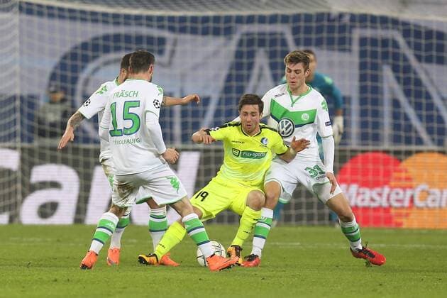 Wolfsburg s Christian Trasch, Gent s Brecht Dejaegere and Wolfsburg s Robin Knoche fight for the ball during a game between Belgian KAA Gent and German VfL Wolfsburg, a first leg of the 1 8 finals of the UEFA Champions League competition, in Gent, Wednesday 17 February 2016. BRUNOxFAHY  x04794816x