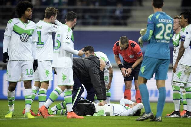 Wolfsburg s Sebastian Jung lies injured on the ground during a game between Belgian KAA Gent and German VfL Wolfsburg, a first leg of the 1 8 finals of the UEFA Champions League competition, in Gent, Wednesday 17 February 2016. YORICKxJANSENS  x04794843x