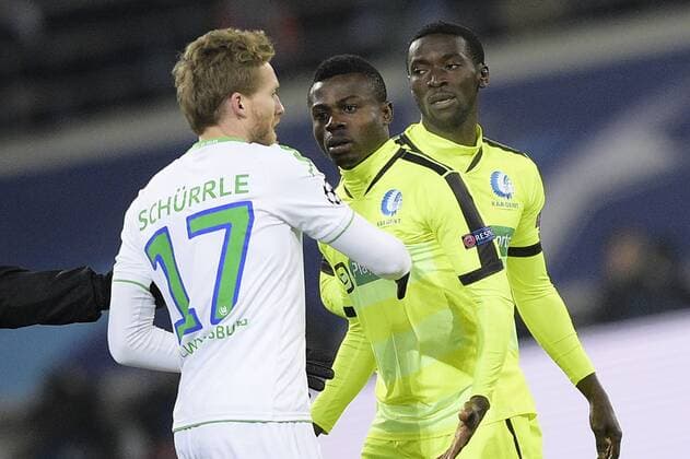 Wolfsburg s Andre Schurrle, Gent s Moses Simon and Gent s Nana Asare pictured during a game between Belgian KAA Gent and German VfL Wolfsburg, a first leg of the 1 8 finals of the UEFA Champions League competition, in Gent, Wednesday 17 February 2016. YORICKxJANSENS  x04794873x