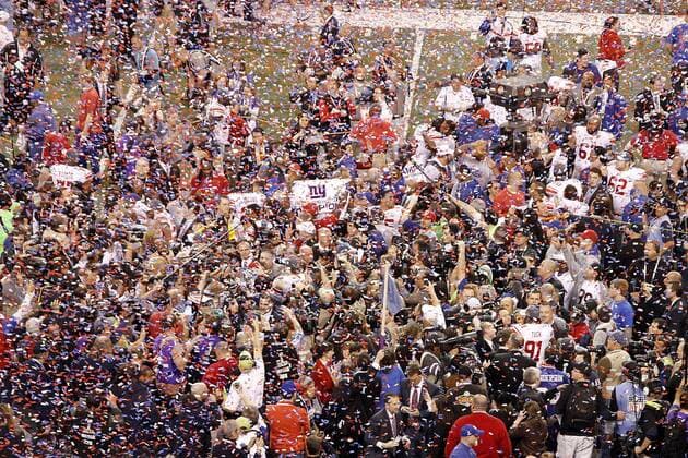 Feb. 5, 2012 - Indianapolis, IN, USA - Confetti rains down on the New York Giants at the conclusion of Super Bowl XLVI. Super Bowl XLVI came down to the final seconds as the New York Giants beat the New England Patriots with a final score of 21-17 in Lucas Oil Stadium in Indianapolis, IN. Photo By Aaron Suozzi Super Bowl XLVI New York Giants vs. New England Patriots - ZUMAs102