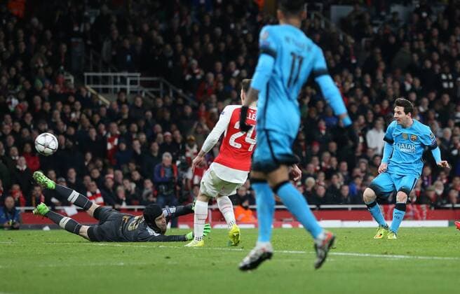 Barcelona s Lionel Messi scoring his sides opening goal UEFA Champions League 2nd Round First Leg - Arsenal vs Barcelona - Emirates Stadium -England - 23rd February 2016 - Picture David Klein Sportimage EDITORIAL USE ONLY. No use with unauthorised audio, video, data, fixture lists, club league logos or live services. Online in-match use limited to 120 images, no video emulation. No use in betting, games or single club league player publications.